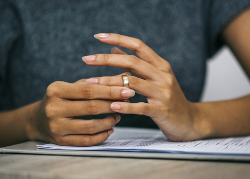 woman playing with wedding ring on finger